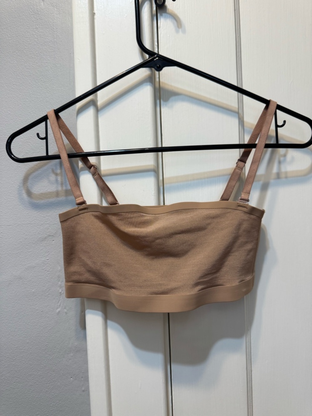 SKIMS Light Brown/Nude Seamless Bandeau Bralette with Adjustable Straps.